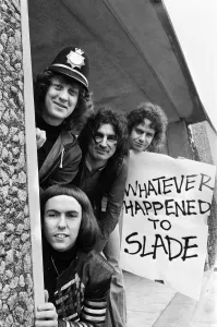 Glam rock group Slade posing for pictures in Birmingham City Centre. 25th March 1977