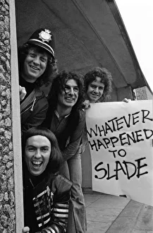Glam rock group Slade posing for pictures in Birmingham City Centre. 25th March 1977