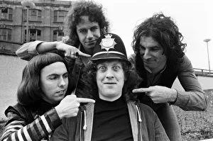 01086 Prints: Glam rock group Slade posing for pictures in Birmingham City Centre. 25th March 1977