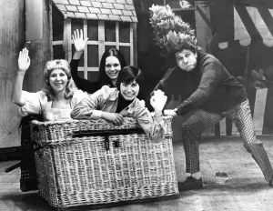 Glamour girls Wendy Bowman, Carol Asti and Cathy Cota with panto dame Clifford Henry who