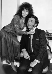 Glamour model Linda Lusardi applies some last minute makeup to Terry Wogan presenter of