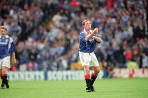 Glasgow Rangers footballer Paul Gascoigne making a one finger gesture while sticking out