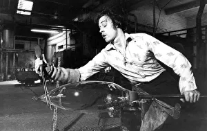 A glass blower at Hartley Wood in Sunderland making stained glass lighting for