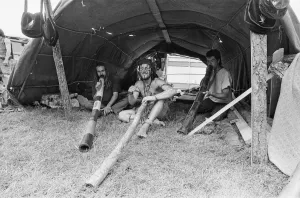 Somerset Prints: Glastonbury Festival 1994. Festival goers enjoy life with their didgeridoos