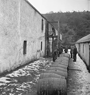 Whisky Prints: A Glenlivet Distillery workers seen here with barrels of their finest single malt whisky