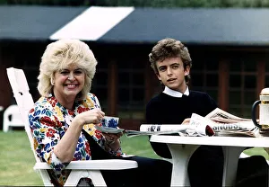 Gloria Hunniford TV and Radio Presenter with her son Michael sitting at a table drinking