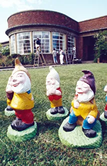 Warm Prints: Gnomes basking in the sun, while trainees paint a training centre