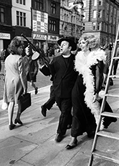 Anything goes for singer Marian Montgomery and Michael Segal (complete with tommy-gun
