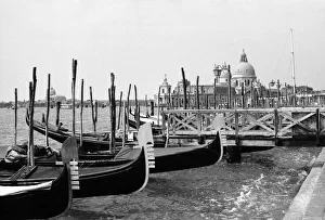 Canal Prints: Gondolas moored with the Santa Maria della Salute church in the background in Venice