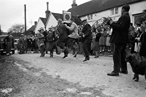 Excercise Prints: Every Good Friday, the road outside the Rose Cottage Inn in the village Alciston