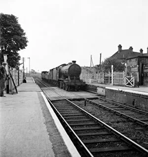 00013 Collection: Goods train pulls into the railway station at Halesworth Suffolk. June 1952 C3365