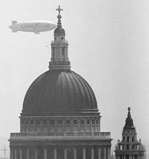 00394 Prints: The Goodyear Airship Europa seen here passing the dome of St Pauls Cathedral
