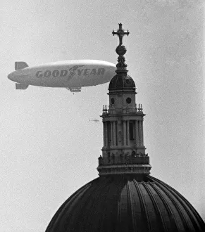 00394 Prints: The Goodyear Airship Europa seen here passing the dome of St Pauls Cathedral
