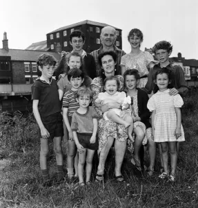 01082 Prints: Gordon Gillick with his wife Victoria Gillick and their ten children at home in Wisbech