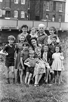 01082 Prints: Gordon Gillick with his wife Victoria Gillick and their ten children at home in Wisbech