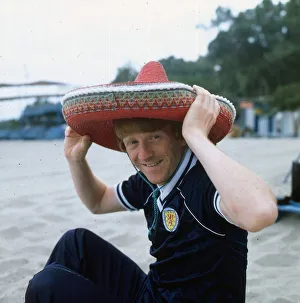 Gordon Strachan wearing a Scotland strip and a sombrero as he relaxes during the 1982