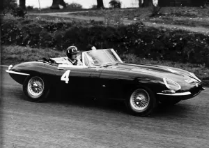 Graham Hill in E Type Jaguar motor racing practice Oulton Park