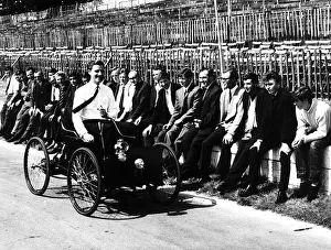 Classic Prints: Graham Hill racing driver driving a replica of first Ford car Quadricycle made by