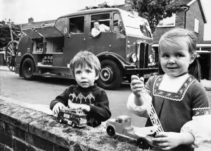Firefighter Prints: Graham and Lorna Pearson with their dad Paul Pearson in the refurbished vintage fire