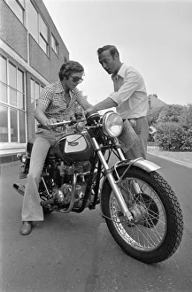 Grand Prix motorcycle road racer Phil Read sits on an Norton Villiers Triumph Bonneville