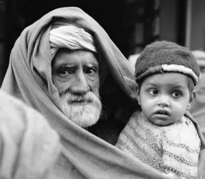 Turban Prints: A grandfather and his grandson seen here on the streets of Peshawar the capital of