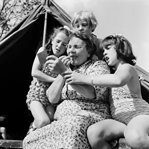 00585 Prints: Grandmother Rosina Cox shows her grandchildren 10 year old Frances Gee