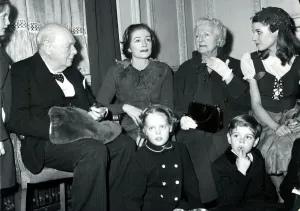 Grandpa Sir Winston-hand in muff-presides over a family group at London