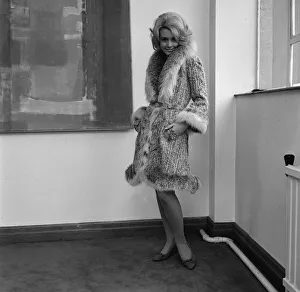 Graziella Fontana fashion June 1965 Model standing in the corner of a room wearing