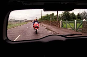 Green Vauxhall Astra van July 1999 with red Honda motorbike