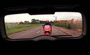 Green Vauxhall Astra van July 1999 with red Honda motorbike