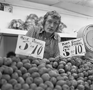 Vegetables Prints: Greengrocer and his fruit and veg stall in Staffords indoor market. Circa June 1974