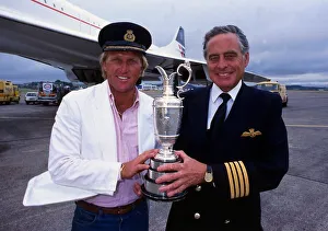 00268 Prints: Greg Norman holds the Claret Jug trophy after winning the British Open with Concorde