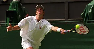 GREG RUSEDSKI IN ACTION AGAINST DANIEL NESTOR WIMBLEDON TENNIS CHAMPIONSHIPS
