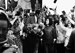 Greeting Prints: Gregory Peck actor arrives at Denham airport to be greeted by Chinese actors that star