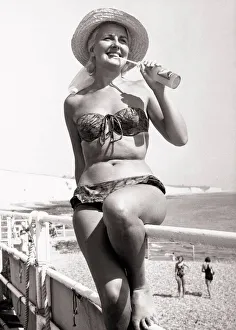 Bottle Prints: Greta Miller singer from Glasgow on the beach at Brighton wearing a bikini