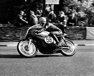 Griff Jenkins (No. 59) winner of the Senior Manx Grand Prix at speed