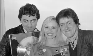 00116 Prints: Griff Rhys Jones with fellow comedians Rowan Atkinson and Pamela Stephenson all receiving