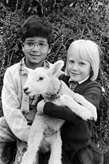 Grinning sheepishly... seven-year-old Amman Hafiz and Chloe Jenkinson, six