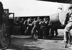 Usaf Prints: Ground crewmen look on tensely as the combat crewmen of an Eighth US Air Force Flying
