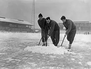 01357 Prints: Grounds staff at Bristol Rovers Eastville Stadium struggle to clear snow from the pitch