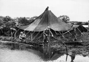 01441 Prints: A group of American soldiers build a dam to keep the river from flooding after it burst