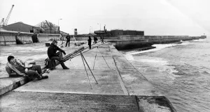 Relaxation Prints: A group of anglers enjoying a spot of fishing on the pier at the mouth of the River Wear