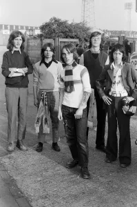 Flares Prints: Group of football supporters gathered outside the ground before a match