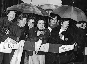 Beatlemania Prints: A group of girls who waited in the rain to greet their idols outside the Birmingham