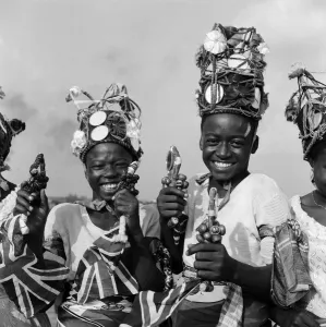 Traditional Prints: A group of Nigerian dancers who are performing in traditional costume for Queen Elizabeth