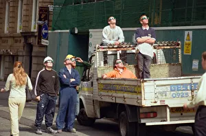 01106 Prints: A group of workmen in Liverpool city centre watching the solar eclipse. 11th August 1999