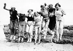 Beachwear Prints: Group of young women showing off the latest beachwear fashions at the English League