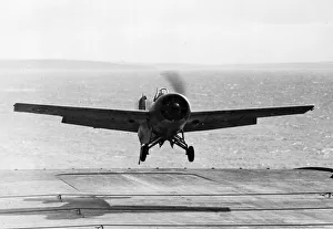 A Grumman Wildcat of No 882 Squadron Fleet Air Arm landing on HMS Victorious Circa
