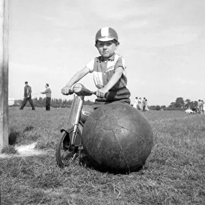 On Guard! Standing sentry duty over a ball almost as big as himself is 5 yr old Russell