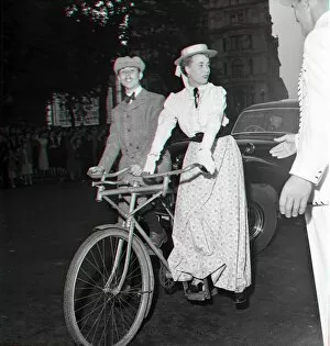00013 Collection: Guests arrive in Edwardian dress on a bicycle made for two for the premiere of '